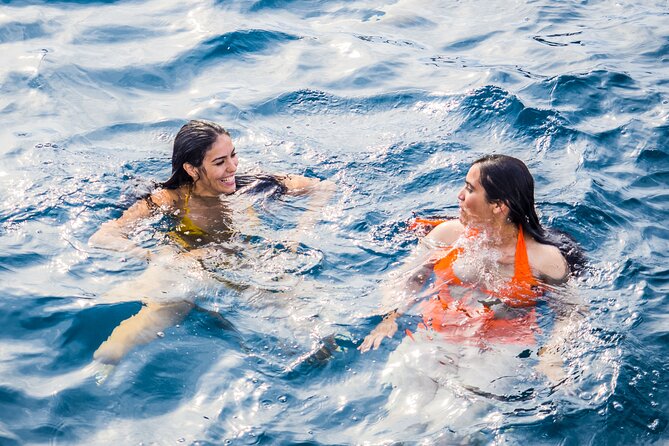 Catamaran tour with swimming stop in Malaga - Onboard vibe: lounge spots, crew energy, and small surprises