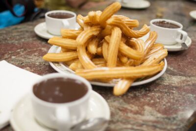 Malaga: City Center Walking Tour with Tapas Food Tastings - Calle Granada and Iglesia de Santiago: Old Streets, Real Atmosphere