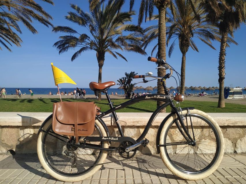 Malaga: Guided Bike Tour - La Farola lighthouse: whitewashed icon at the port entrance