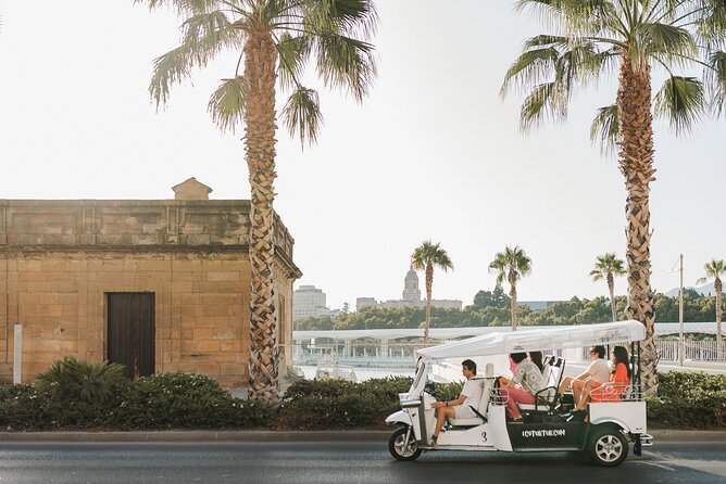 Malaga Welcome Tour with Local Guide in Eco Tuk Tuk Private - La Malagueta Beach and Baños del Carmen: sea air plus local flavor