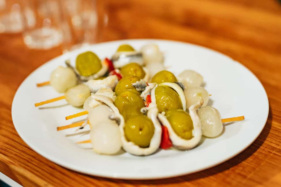 Malaga's tradition and tapas tour with Official Guide - The First Restaurant: Classic Dishes Explained Alongside a Drink