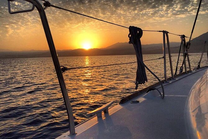 Marbella Small Group Catamaran with Dolphin Watching - Drinks, music, and where to focus on the sail back