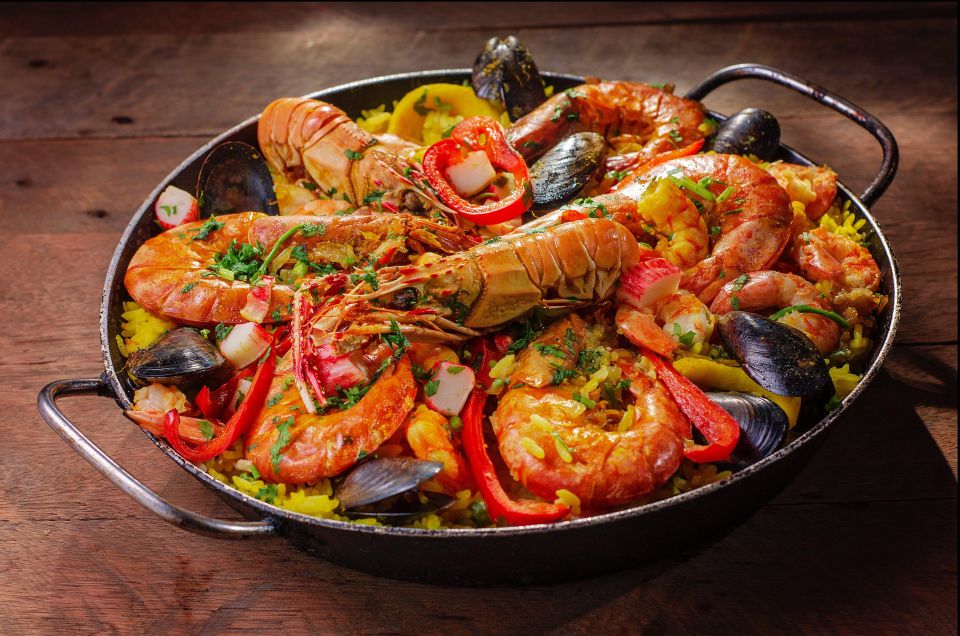 Tapas Tour Paella and Malaga market with Official Guide - Stop 1 and the opening bar: snack, sip, and set your palate