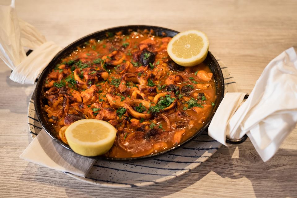 Tapas Tour Paella and Malaga market with Official Guide - Malaga wine at a 1840 tavern: taste tradition, not marketing